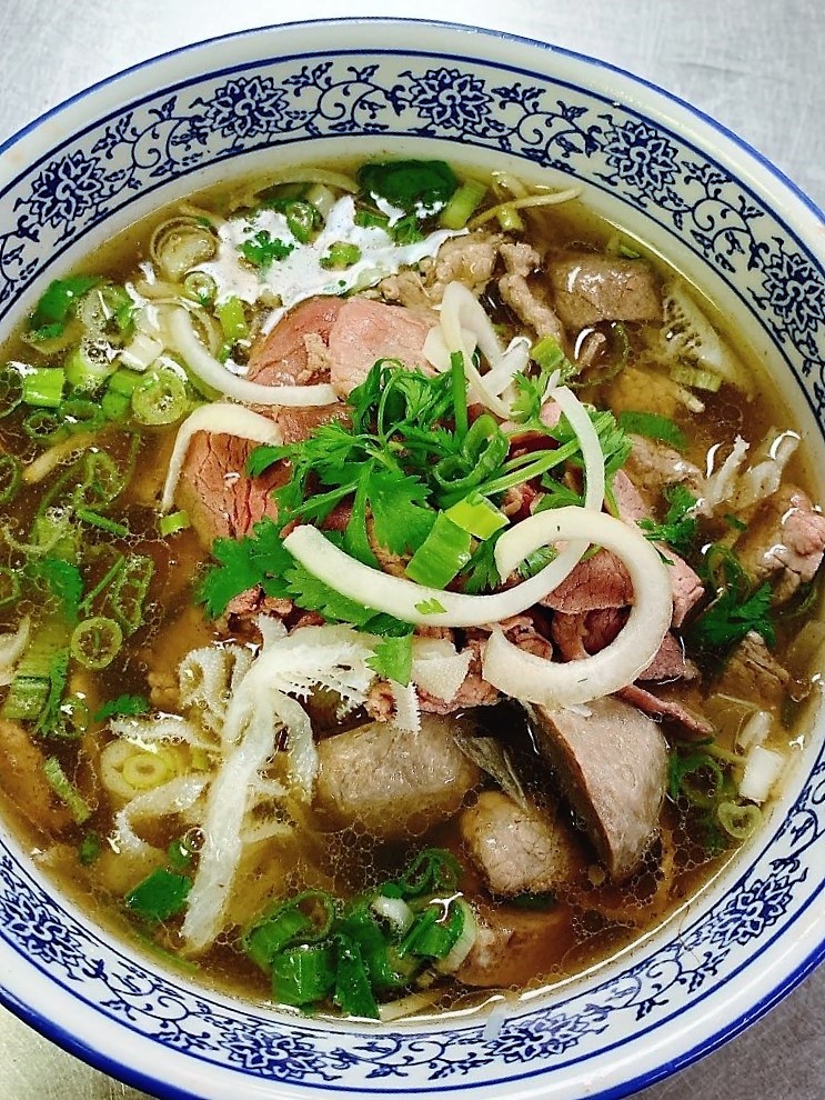 Steaming bowl of special beef pho